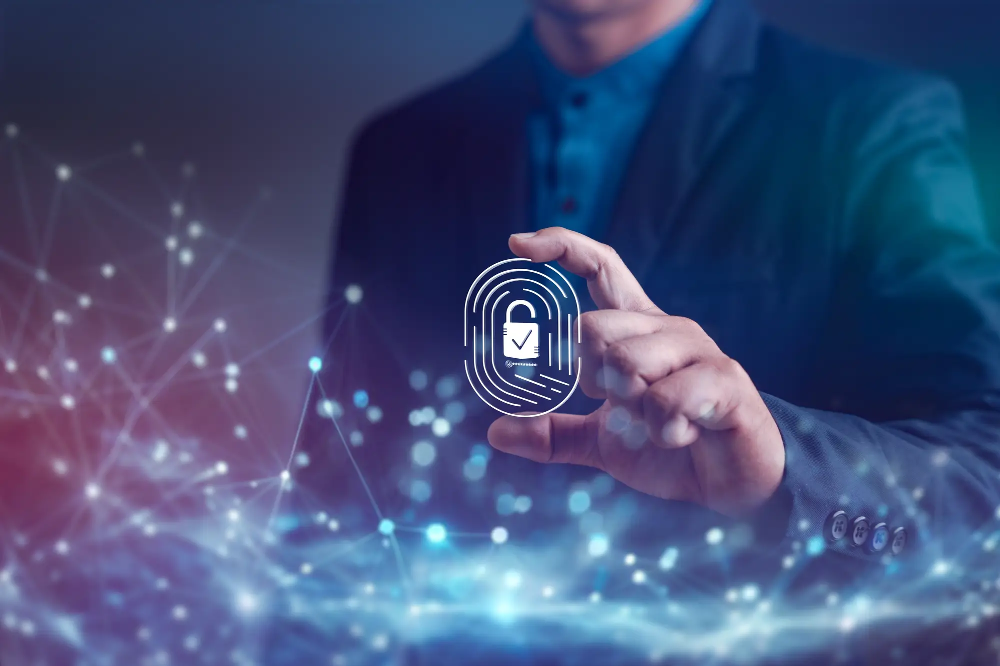 Man holding a secure fingerprint icon with digital security overlay.
