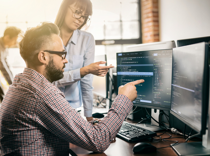 Developing programming and coding technologies. Website design. Programmer working in a software develop company office.