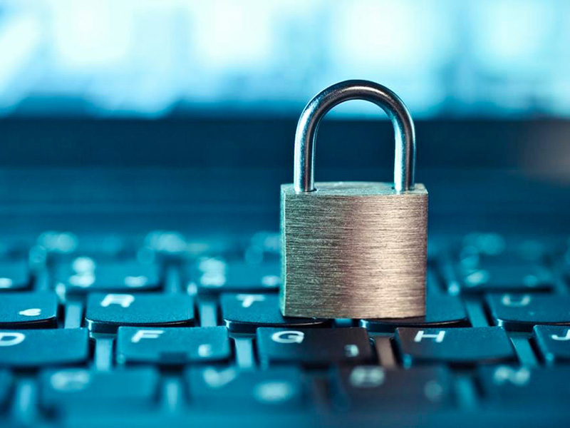 Padlock on computer keyboard symbolizing strong cybersecurity protection.